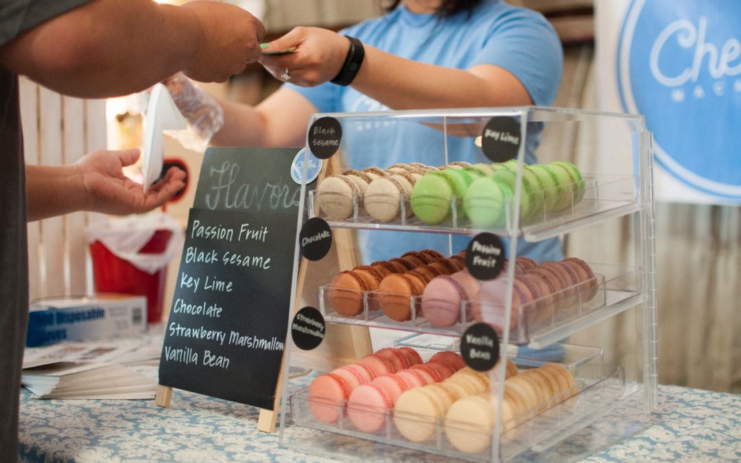 person purchasing macarons